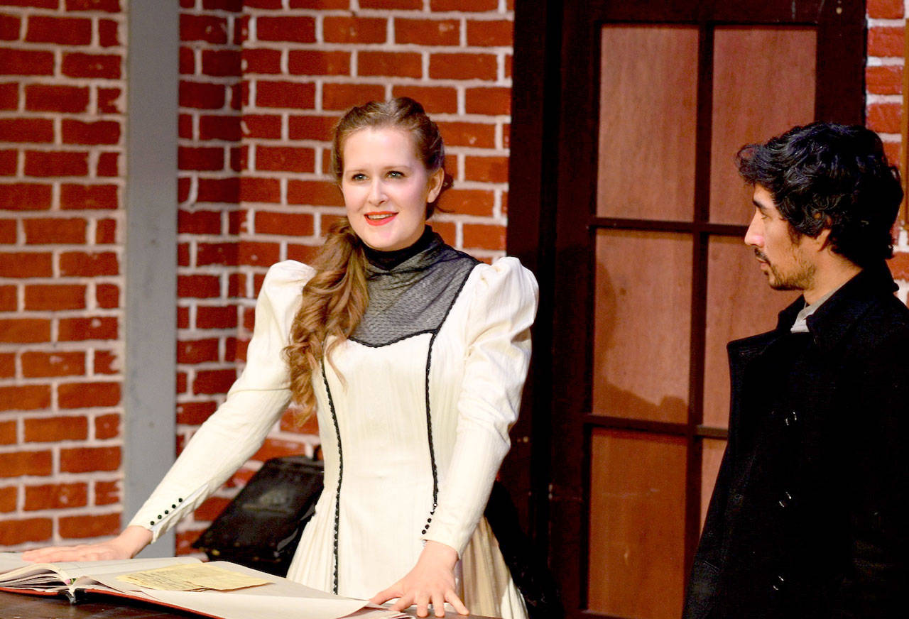 Young Henrietta Maynard (Maggie Jo Bulkley) imagines the future while a suitor (Tomoki Sage) admires her in “Spirit of the Yule” at Key City Public Theatre. (Diane Urbani de la Paz/for Peninsula Daily News)
