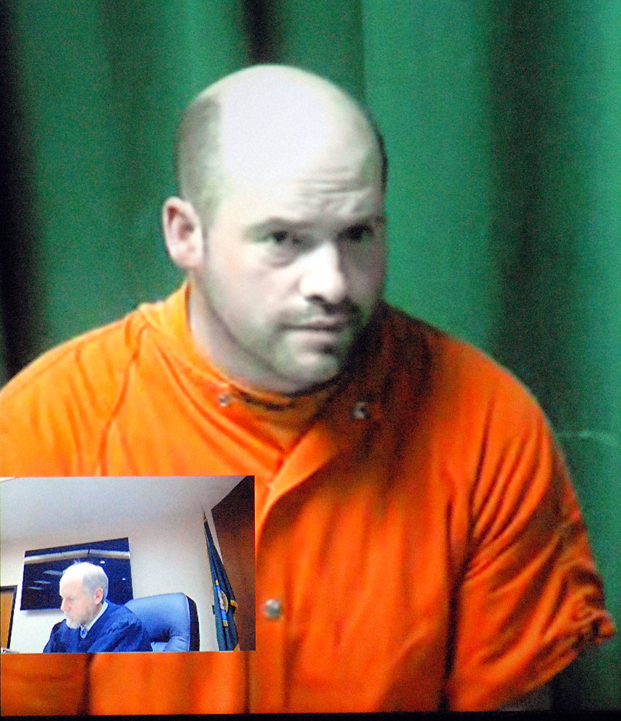 Ryan Warren Ward, 37, appears by video link in February during his first appearance in Clallam County Superior Court in Port Angels on charges of aggravated first-degree murder with firearms enhancements related to a triple homicide in December. Inset in the two-way video appearance is Superior Court Judge Brian Coughenour. (Keith Thorpe/Peninsula Daily News file)