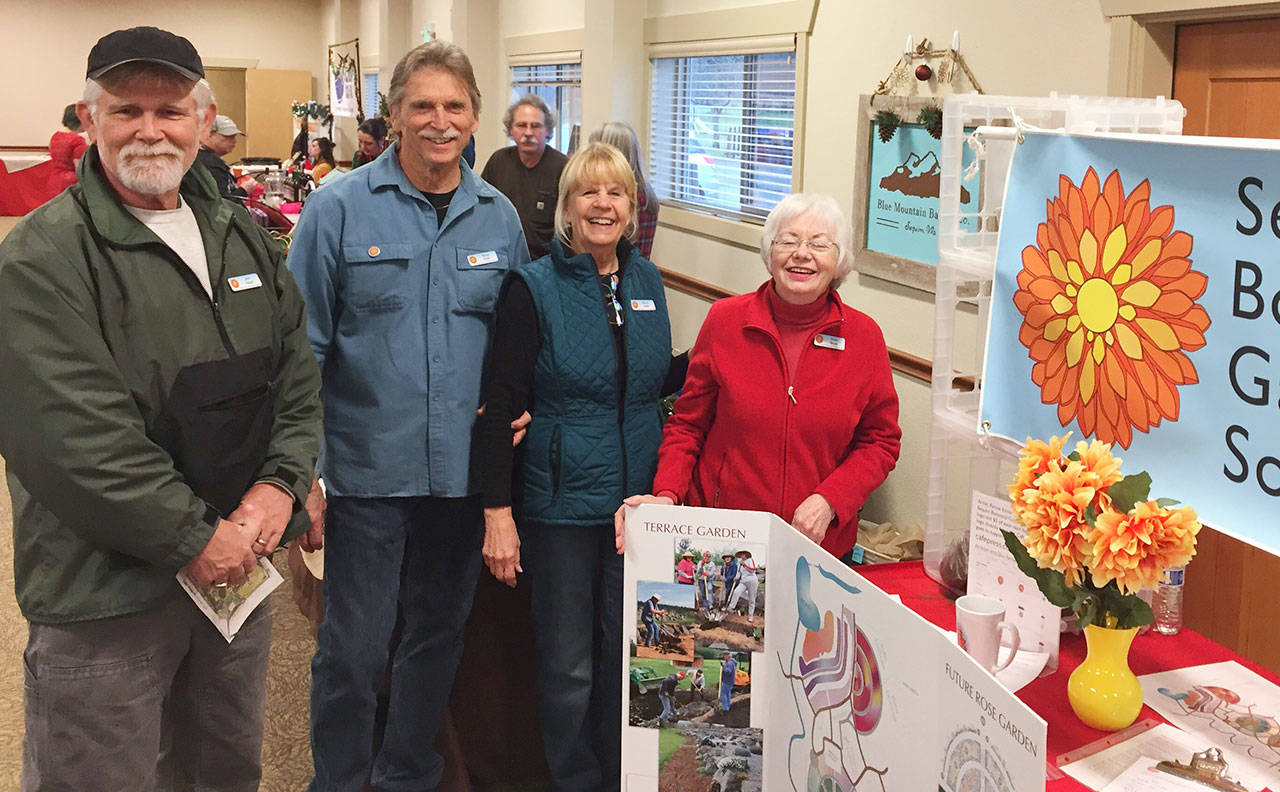 The Sequim Botanical Garden Society will hold a Surprise Peony Pack Fundraising Effort on Saturday at the Sequim Farmers Market Holiday Fair. Pictured, from left, are society members John Hassel, Randy Smith, Sherry Smith and Dona Brock.