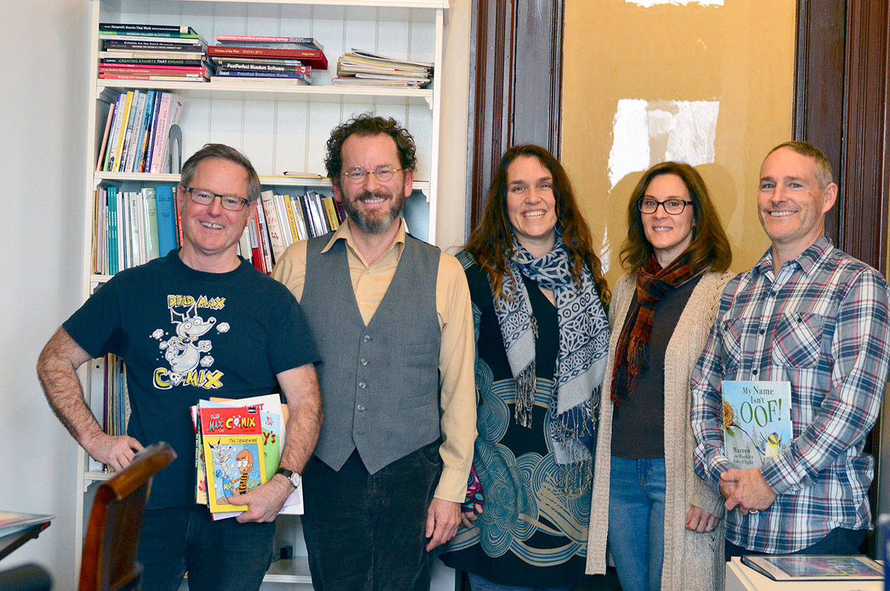 A quintet of local children’s authors, from left, Dana Sullivan, Patrick Jennings, Faith Pray, Rowena Russell and Michael Galligan, get together at the Jefferson Museum of Art & History twice a month. (Diane Urbani de la Paz/For Peninsula Daily News)