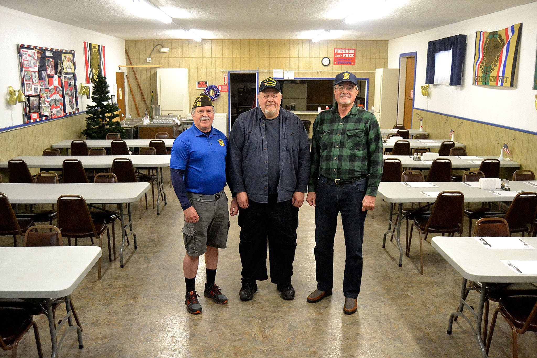 Leaders of the Sequim VFW Post 4760, from left, Post Commander Kevin O’Neill, Quartermaster Steve Henrikson, and Past-Commander Neil Gamroth, stand in the post’s hall and kitchen area where they’ll continue to host breakfasts, meetings and other events. The post sold its building this summer but continues to lease its canteen/dance hall and hall/kitchen. (Matthew Nash/Olympic Peninsula News Group)