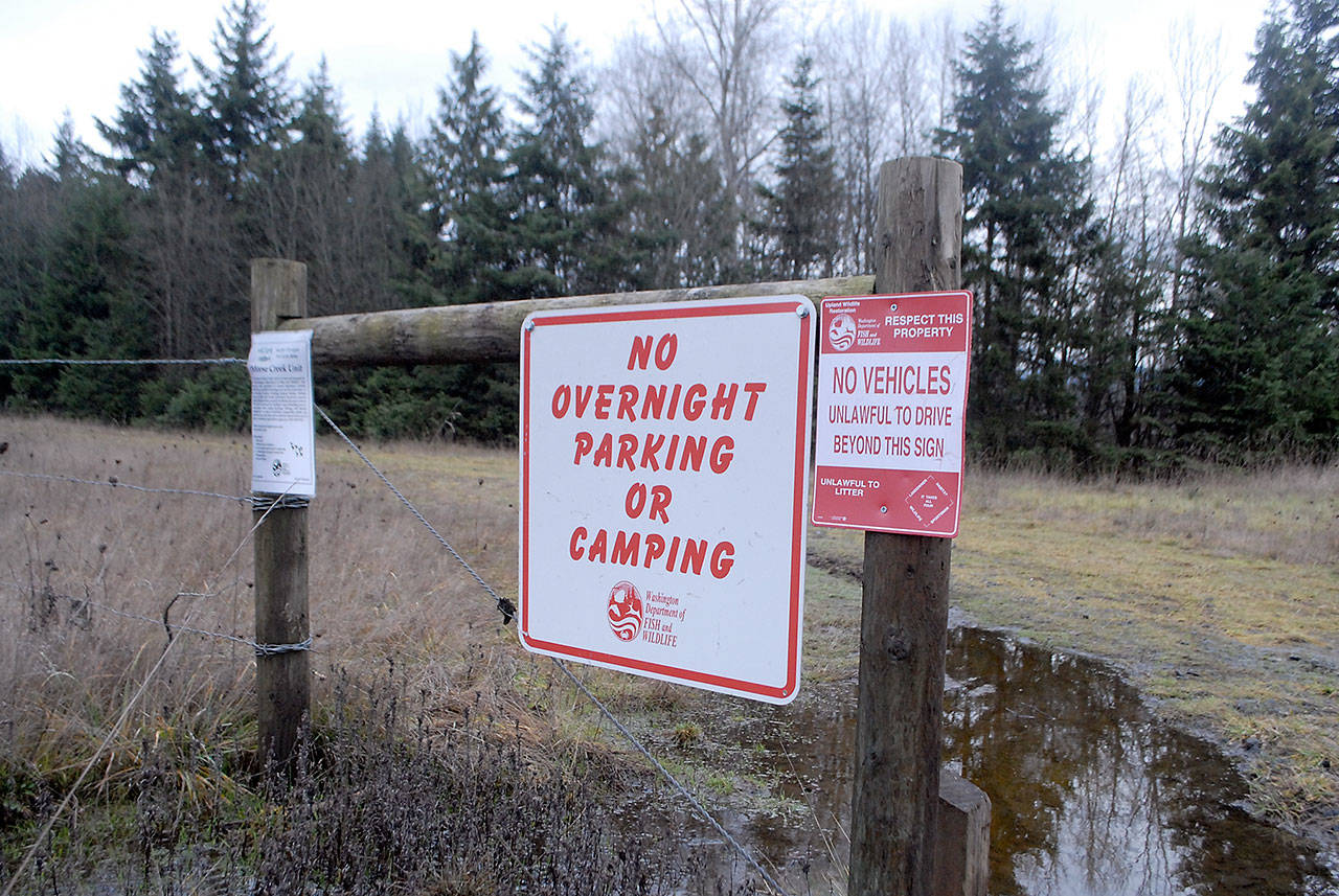 A sign indicating a ban on camping or overnight parking is posted near the front gate of a parcel Washington State Fish and Wildlife land in the Morse Creek Valley east of Port Angeles.                                (Keith Thorpe/Peninsula Daily News)