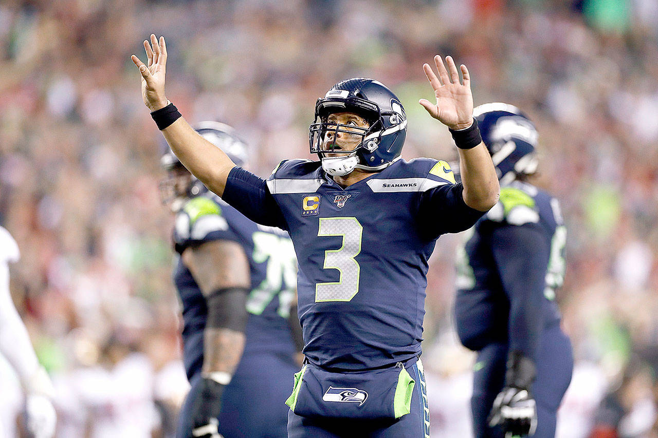Seattle Seahawks quarterback Russell Wilson (3) celebrates a touchdown during an NFL game against the San Francisco 49ers on Sunday, Dec. 29, 2019, in Seattle. The 49ers defeated the Seahawks 26-21. (Greg Trott via AP)