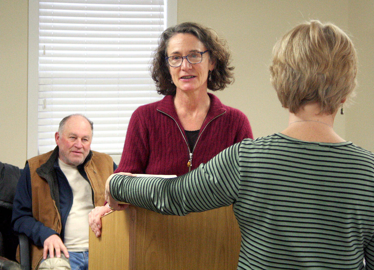 Pam Petranek takes the oath of office Thursday as she becomes the first female commissioner in the 95-year history of the Port of Port Townsend. (Brian McLean/Peninsula Daily News)