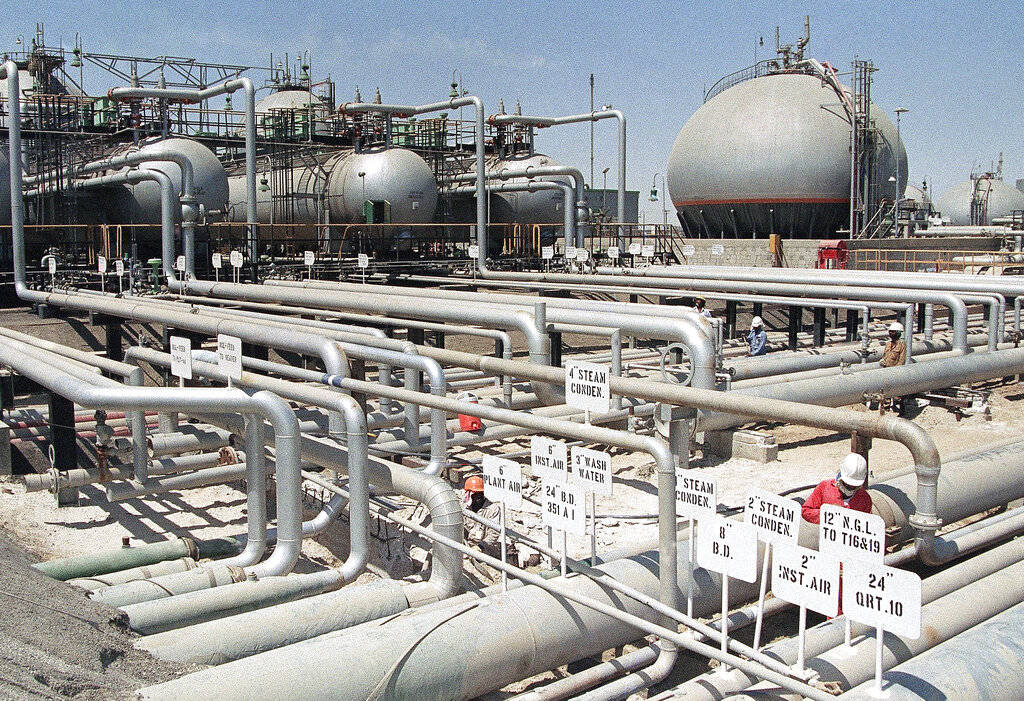 In this file photo dated 1990, Aramco refinery is at Ras Tannura, Saudi Arabia. The price of oil surged Friday, Jan. 3, as global investors were gripped with uncertainty over the potential repercussions and any retaliation after the United States killed Iran’s top general, Qassem Soleimani. (AP Photo/File)