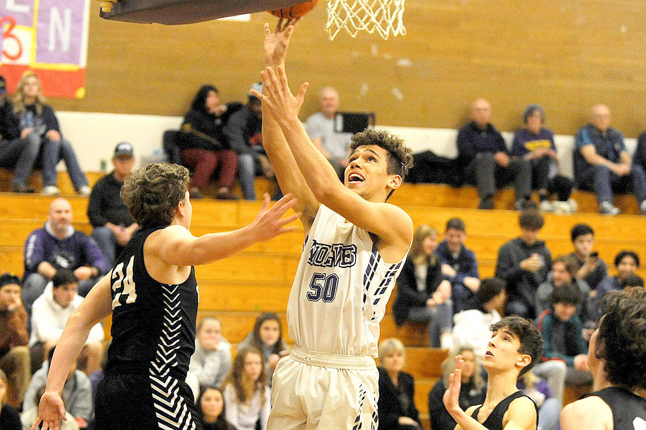 Sequims Hayden Eaton goes up for a layup against Central Kitsap on Friday. The Wolves beat the visiting 3A team 57-55. (Conor Dowley/Olympic Peninsula News Group)