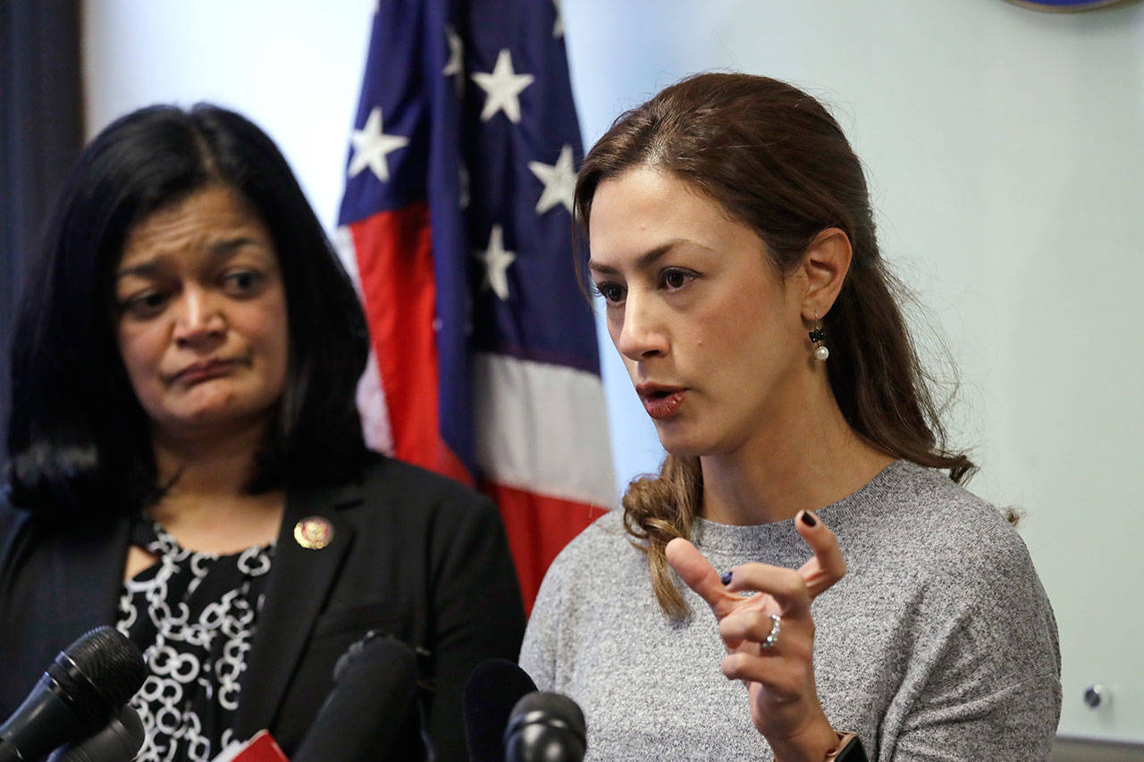 Rep. Pramila Jayapal, D-Wash., left, looks on as Negah Hekmati speaks about her hours-long delay returning to the U.S. from Canada with her family days earlier during a news conference Monday in Seattle. Civil rights groups and lawmakers were demanding information from federal officials following reports that dozens of Iranian-Americans were held up and questioned at the border as they returned to the United States from Canada over the weekend. (AP Photo/Elaine Thompson)