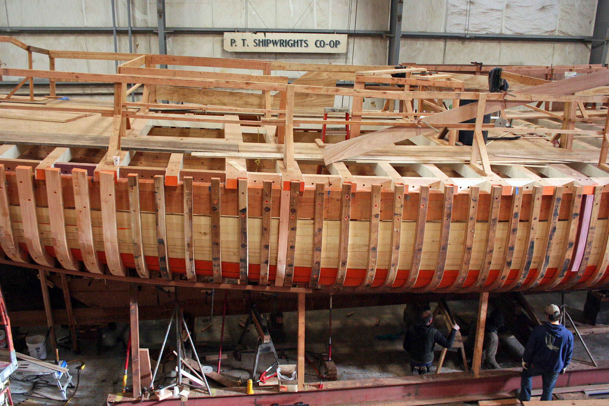 The Western Flyer, the fishing boat made famous by John Steinbeck and Ed Ricketts in the book “Sea of Cortez: A Leisurely Journal of Travel and Research,” is being restored inside the Port Townsend Shipwright’s Co-op building. (Brian McLean/Peninsula Daily News)