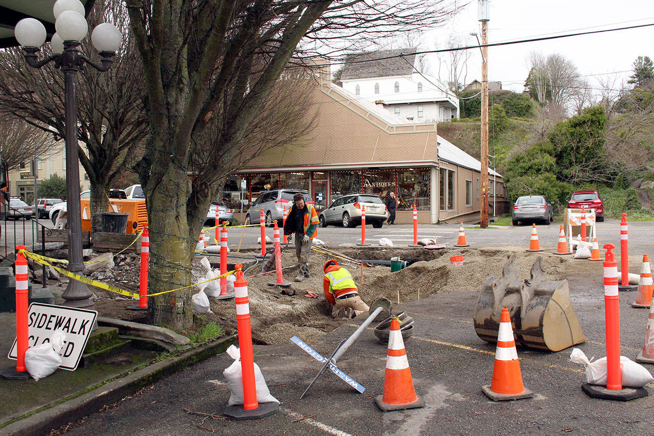 Workers from Shawn Canepa Contracting work on the Adams Street Curb Ramps project on the corner of Adams and Washington streets Tuesday afternoon. Modifications to the sidewalk and streets there include a new bulbout, new stormwater facilities and three new ADA ramps. (Zach Jablonski/Peninsula Daily News)
