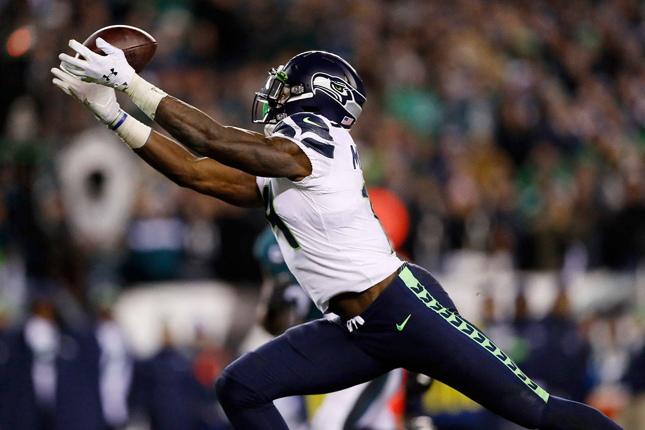 Seattle Seahawks’ D.K. Metcalf catches a touchdown pass during the second half of an NFL wild-card playoff football game against the Philadelphia Eagles, Sunday, Jan. 5, 2020, in Philadelphia. (AP Photo/Julio Cortez)