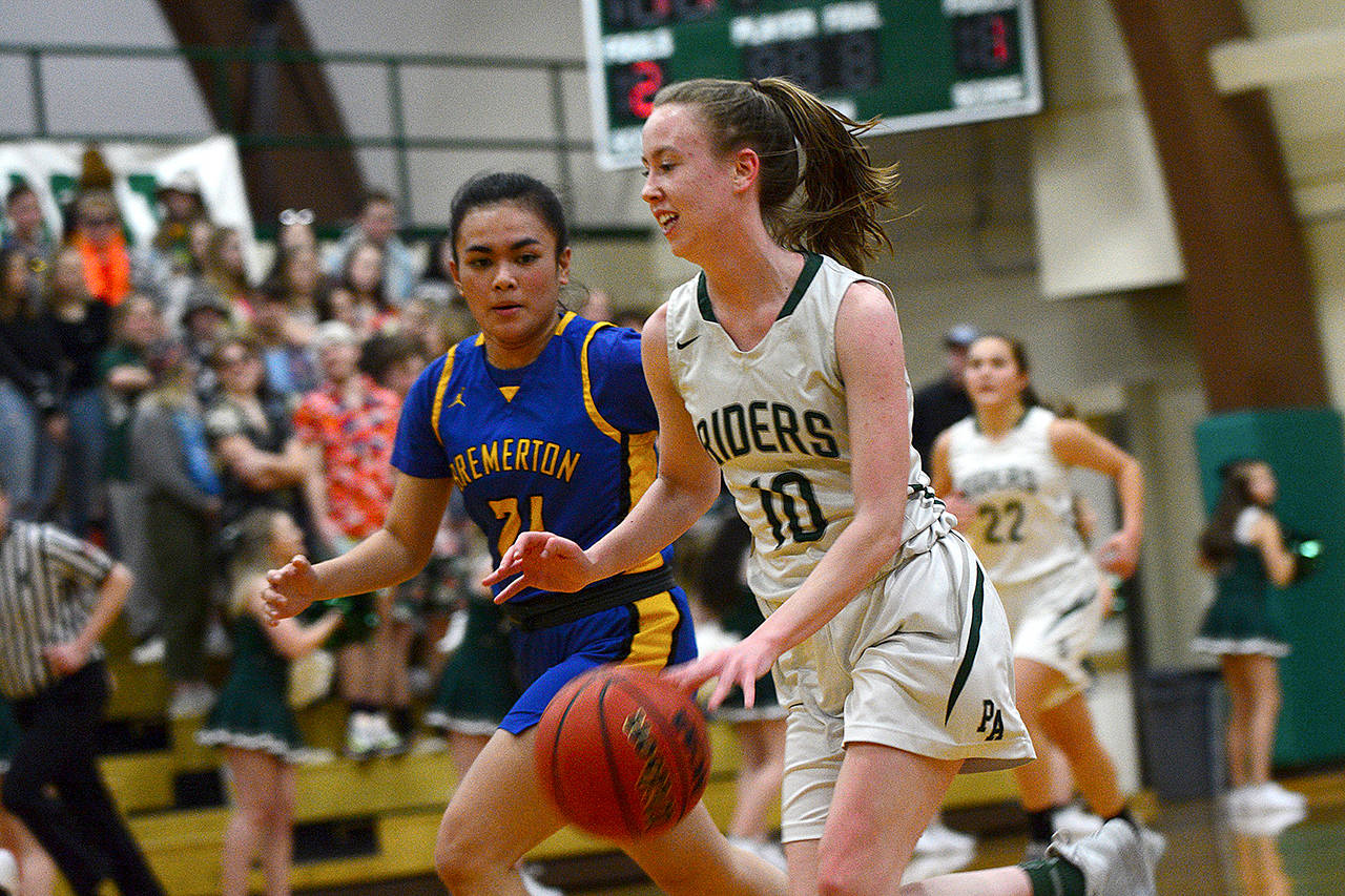 Jesse Major/for Peninsula Daily News Port Angeles Mikkiah Brady runs up court in the Roughriders game against Bremerton Friday.