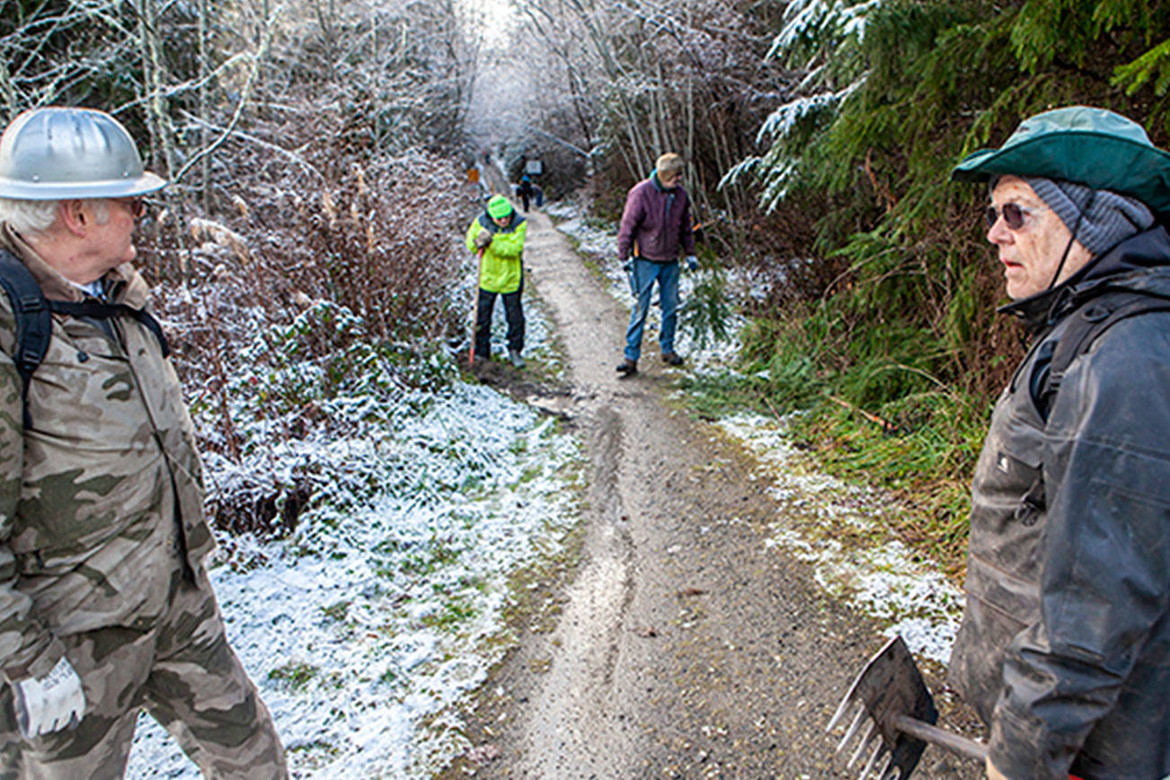 Workers help keep Olympic Discovery Trail groomed