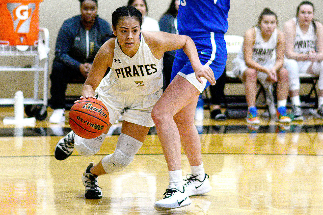 Peninsula College’s Leilani Padilla drives past an Edmonds Community College defender during a game Saturday. (Jesse Major/for Peninsula Daily News)