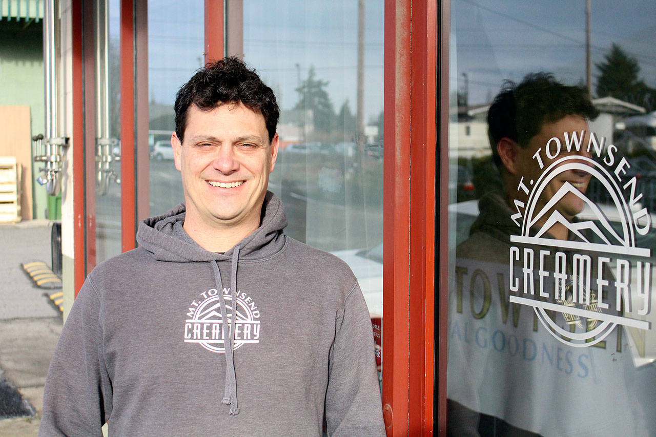 Mt. Townsend Creamery co-founder Ryan Trail stands outside the retail shop. Mt. Townsend Creamery’s last day of production is Jan. 31.It will continue to sell the remaining cheese through February. (Zach Jablonski/Peninsula Daily News)