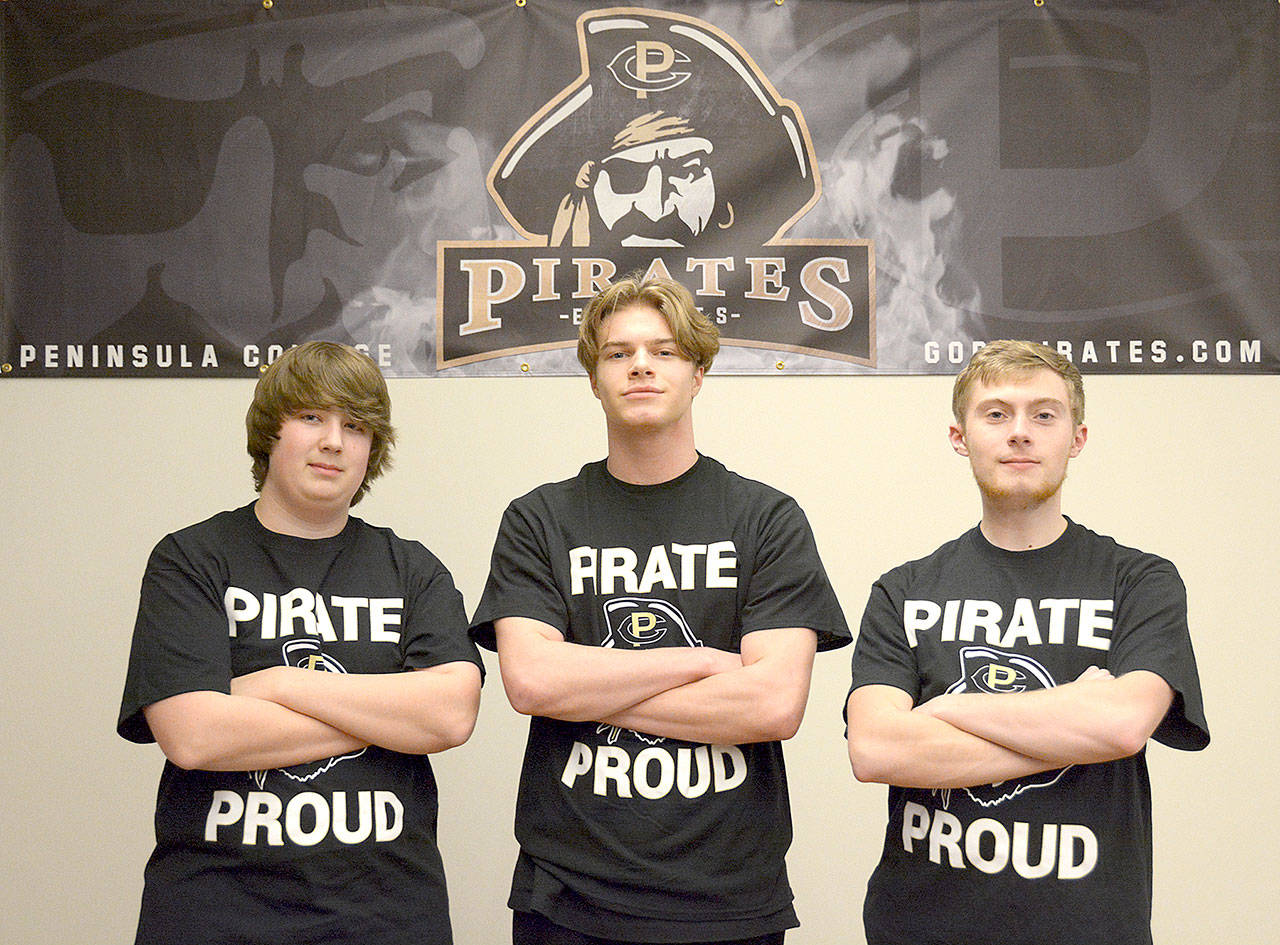 Peninsula College Rocket League esports members, from left, Nicholas Charters, Stuart Koehler and Drew Eckard earned the first victory for the Peninsula College esports program last week.