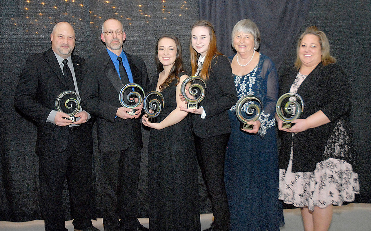 Recipients of 2020 Port Angeles Community Awards gather after Saturday night’s ceremony at Vern Burton Community Center. The winners were, from left, Ken Simpson, representing Angeles Electric for business of the year; Doug Gailey of Port Angeles High School for educator of the year; Salina Treider of Studio 360 for emerging business of the year; Addie Holland for young leader of the year; Norma Turner for citizen of the year; and Emily Dexter of the Port Angeles Food Bank for organization of the year.