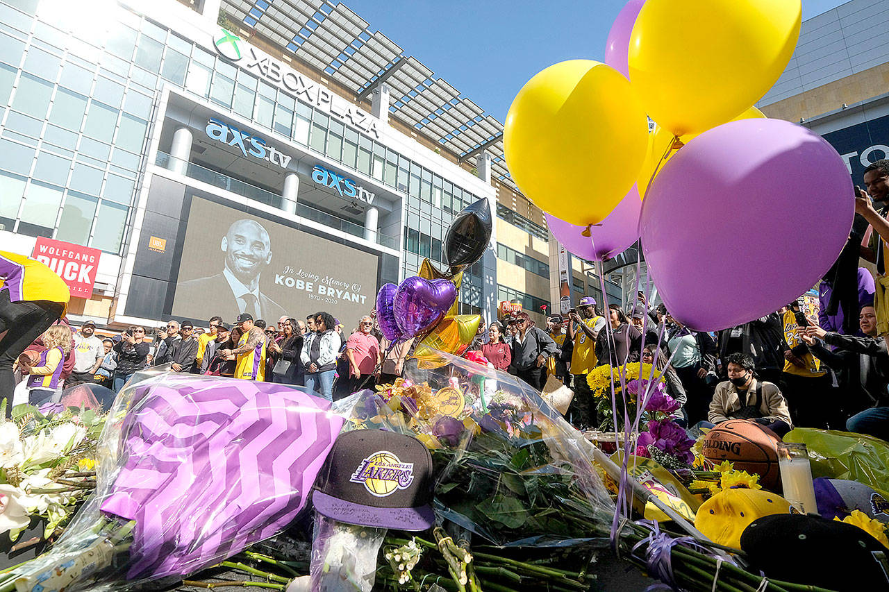 A memorial for Kobe Bryant near Staples Center Monday, Jan. 27, 2020, in Los Angeles. Bryant, the 18-time NBA All-Star who won five championships and became one of the greatest basketball players of his generation during a 20-year career with the Los Angeles Lakers, died in a helicopter crash Sunday. (AP Photo/Ringo H.W. Chiu)