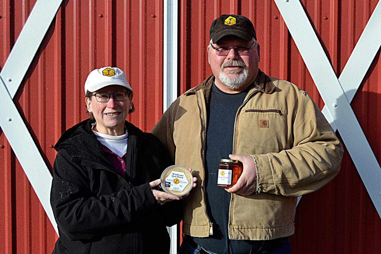 Meg and Buddy DePew stand at their new barn east of Port Angeles where they hope to establish a storefront for their Sequim Bee Farm by spring 2021. The couple won recognition from the Good Food Awards for their honey. (Matthew Nash/Olympic Peninsula News Group)