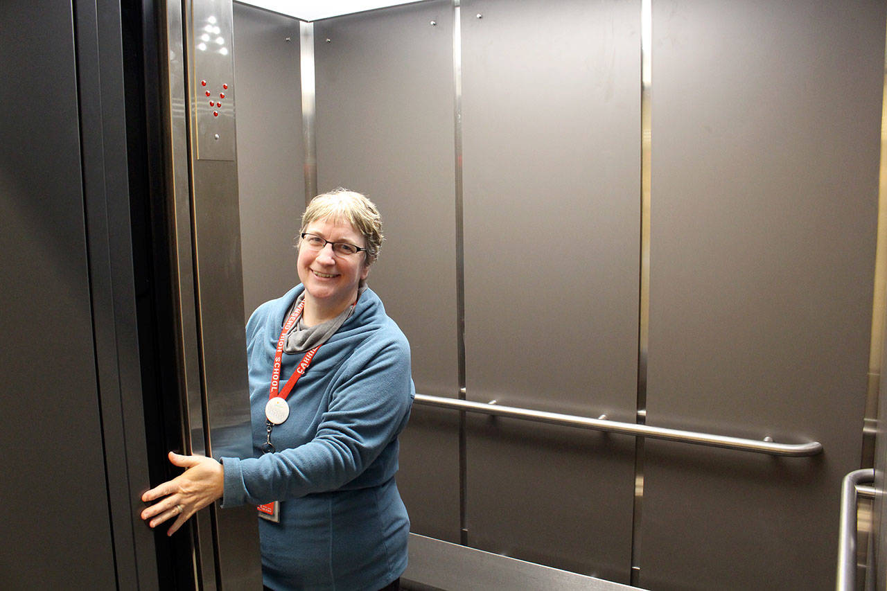 Port Townsend High School Principal Carrie Ehrhardt stands inside the newly completed elevator at the high school. (Zach Jablonski/Peninsula Daily News)