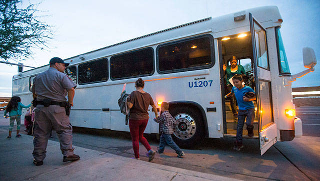 In this May 28, 2014, file photo, migrants are released from ICE custody at a Greyhound bus station in Phoenix. A Customs and Border Protection memo dated Jan. 28, 2020, obtained by The Associated Press confirms that bus companies such as Greyhound do not have to allow Border Patrol agents on board to conduct routine checks for illegal immigrants, despite the company’s insistence that it has no choice but to do so. (Michael Chow/The Arizona Republic via AP)