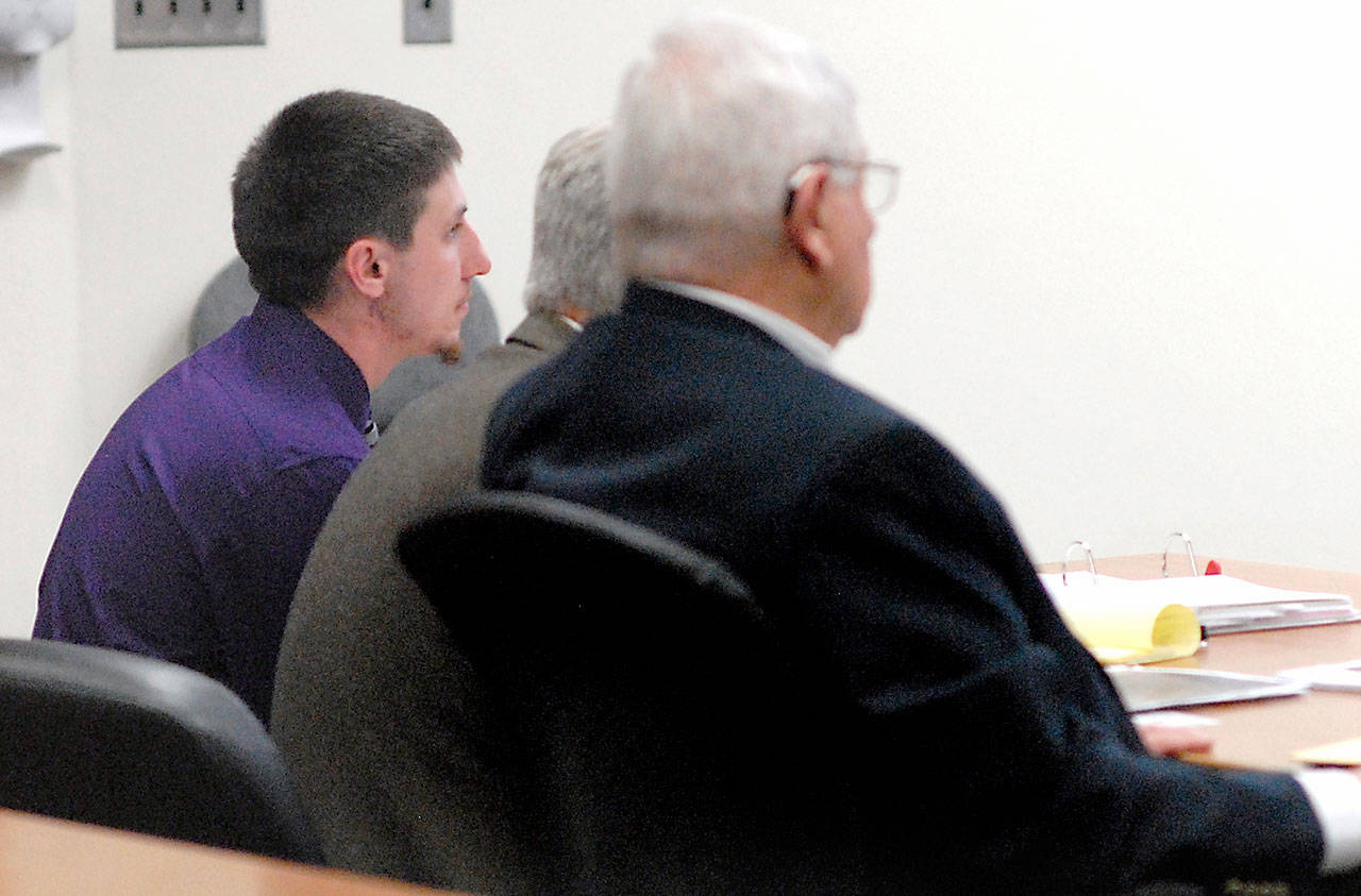 Zachary Alan Fletcher, 23, left, sits with attorneys Lane Wolfley and Larry Freedman during closing arguments in Fletcher’s Clallam County Superior Court trial for two counts of alcohol-related vehicular assault. (Keith Thorpe/Peninsula Daily News)