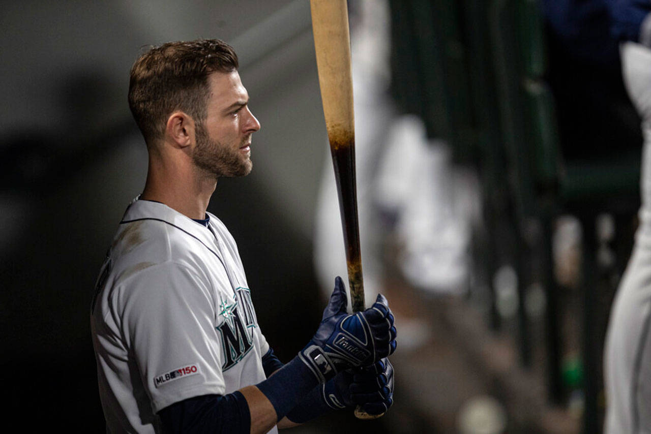 Seattle Mariners’ Mitch Haniger stands in the dugout with bat in hand during a baseball game against the Minnesota Twins, Thursday, May 16, 2019, in Seattle. The Twins won 11-6. (Stephen Brashear/The Associated Press)