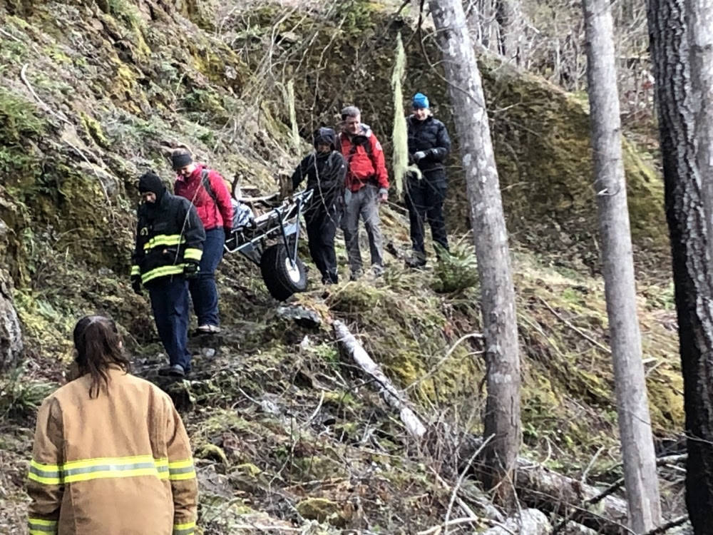 A Jefferson County search and rescue team helps to medically evacuate an injured hiker near Olympic National Park on Saturday. (Jefferson County Sheriff’s Search and Rescue)