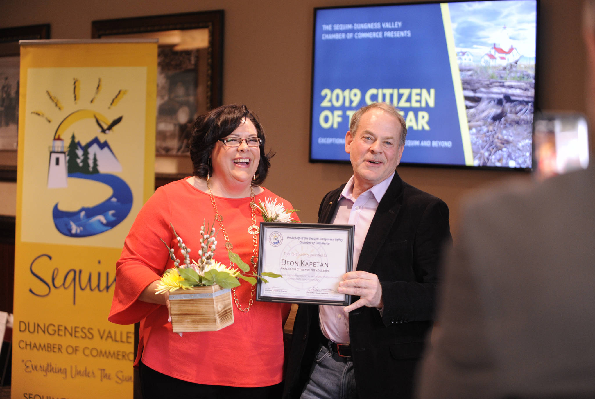 Deon Kapetan, 2019 Sequim-Dungeness Chamber Citizen of the Year, accepts her finalist award from award chair Brown Maloney at the chamber’s annual award ceremony at The Cedars at Dungeness on Feb. 25. (Michael Dashiell/Olympic Peninsula News Group)