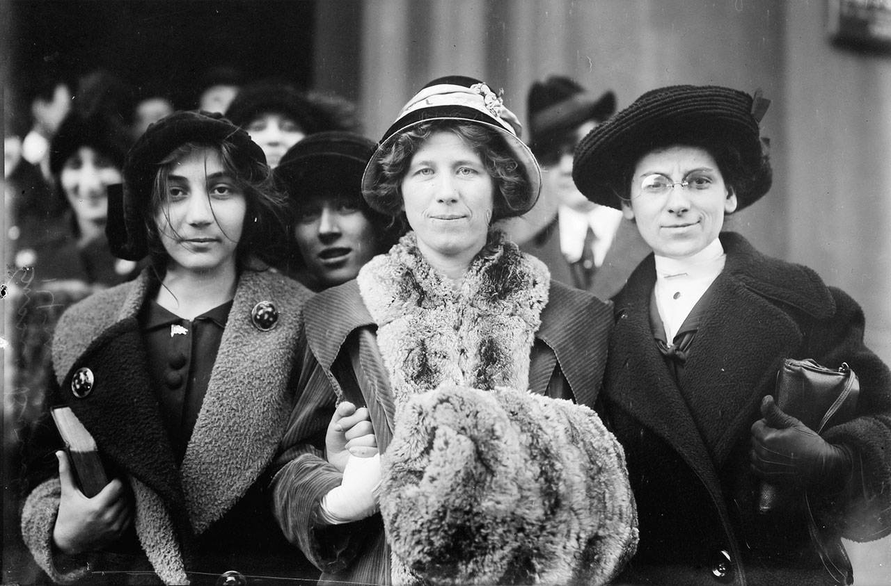 A 14-year-old striker, Fola La Follette and Rose Livingston are shown in a glass negative from the George Grantham Bain Collection, 1913. The photograph shows suffrage and labor activist Flora Dodge “Fola” La Follette, social reformer and missionary Rose Livingston, and a young striker during a garment strike in New York City in 1913. (Libraryof Congress)