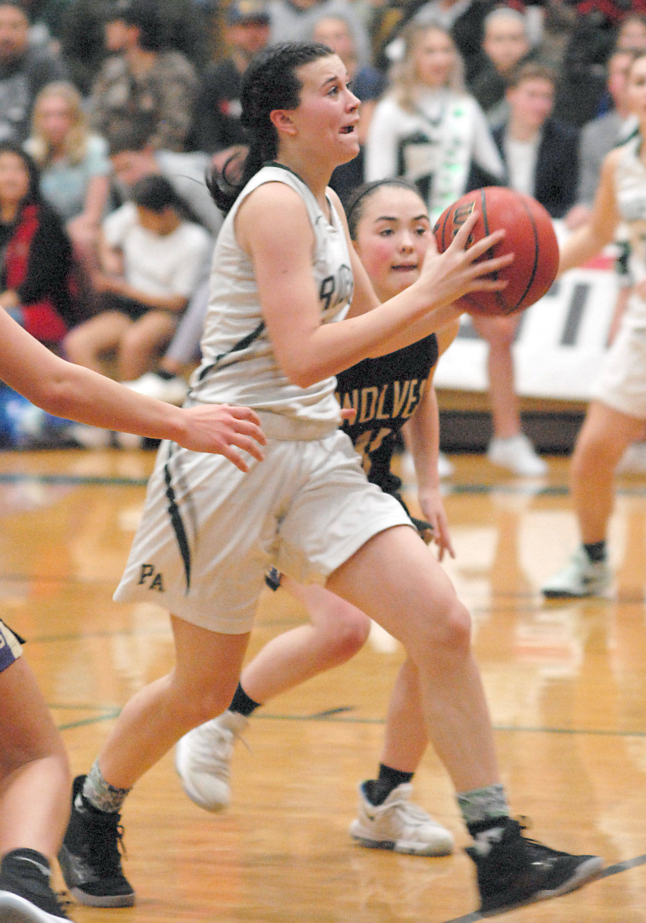 Port Angeles sophomore Bailee Larson, front, has improved as a defender, rebounder and scoring option for the Roughriders this season. (Keith Thorpe /Peninsula Daily News)