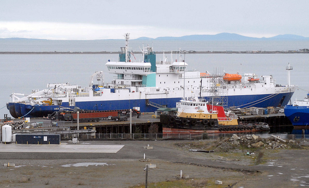 The undersea cable-laying ship Cable Innovator sits moored at the Port of Port Angeles Terminal One Pier on Tuesday, March 3, 2020. The tug Sea Voyager sits in the foreground. (Keith Thorpe/Peninsula Daily News