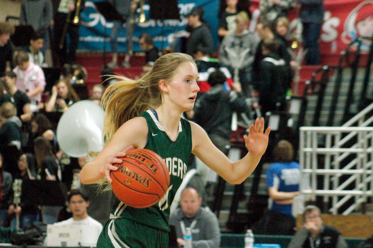 Port Angeles Millie Long dribbles up the court in the fourth quarter of the Riders 50-45 Class 2A Girls Basketball State Tournament loss against Burlington-Edison on Thursday at the Yakima Valley SunDome. (Mark Krulish/Kitsap News Group)