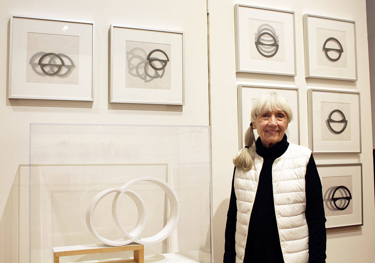 Port Townsend artist and potter Anne Hirondelle stands with pieces of art she has displayed as part of her “Not Done Yet” exhibit at the Jefferson Museum of Art & History. (Zach Jablonski/Peninsula Daily News)
