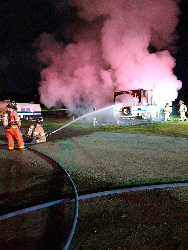 Firefighters from East Jefferson Fire-Rescue work to extinguish a fire in a recreational vehicle just after 1 a.m. Monday at the Jefferson County Fairgrounds. (East Jefferson Fire-Rescue)