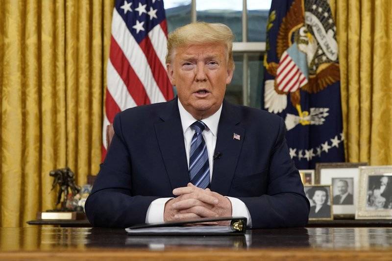 President Donald Trump speaks in an address to the nation from the Oval Office at the White House about the coronavirus Wednesday in Washington. (Doug Mills/The New York Times via AP, Pool)
