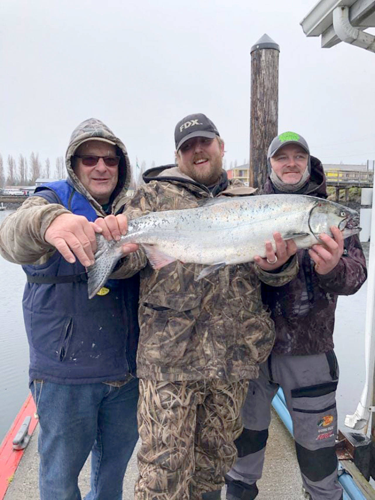 Olympic Peninsula Salmon Derby Bellingham’s Brandon Leeper, center, caught this 15.7-pound hatchery chinook off Port Townsend and is atop the leaderboard after the first day of the Olympic Peninsula Salmon Derby.