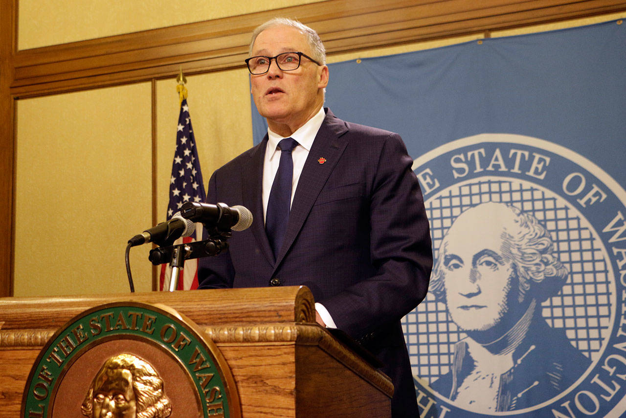 Gov. Jay Inslee speaks to the media after the Legislature adjourned its 60-day session Thursday in Olympia. (Rachel La Corte/The Associated Press)