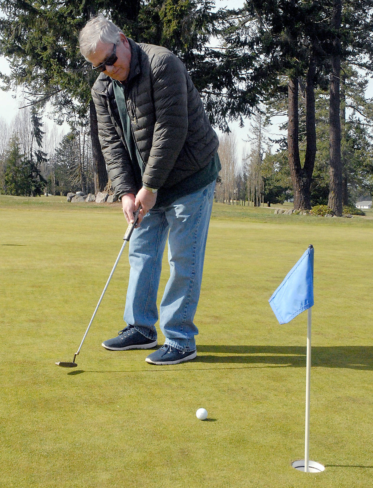Jim Root of Port Angeles practices his putting Tuesday at Peninsula Golf Course in Port Angeles. (Keith Thorpe/Peninsula Daily News)