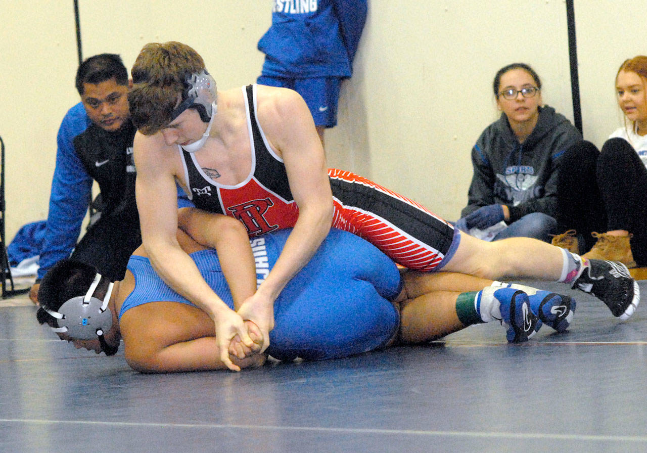 Chimacum’s Kyle Caldwell, top, wrestles in January in Port Angeles. Caldwell finished second in the state at the 1A level at 195 pounds at the Mat Classic. (Keith Thorpe/Peninsula Daily News)