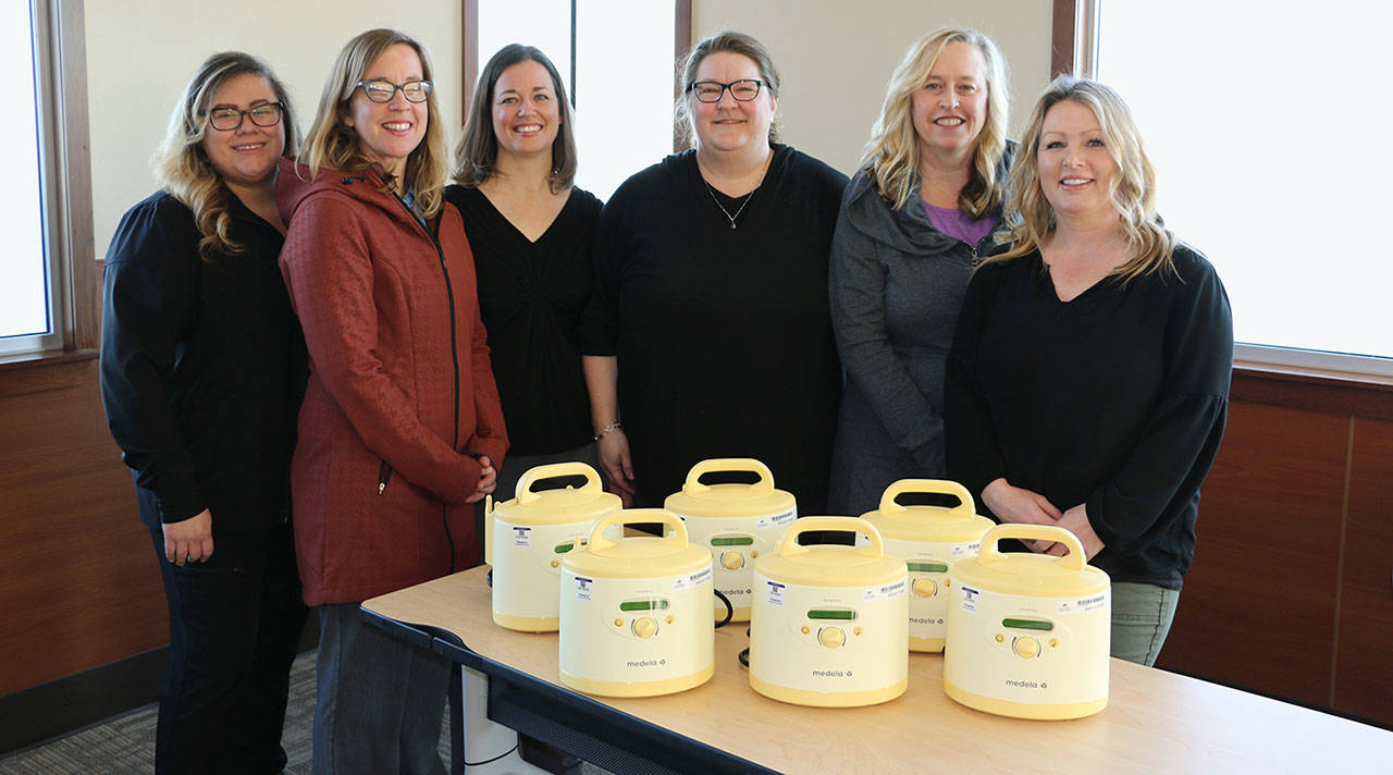 Pictured with new breast pumps purchased with a grant from the Benjamin N. Phillips Memorial Fund are, from left: Samantha Lusk, obstetrics and new family services health unit coordinator; Wendy Schroeder, New Family Services Lactation Consultants Wendy Schroeder, Heidi Byers, Kelly Watkins and Stephanie Steinman; and Chris Johnson, director of obstetrics and new family services. (Photo courtesy of Olympic Medical Center)