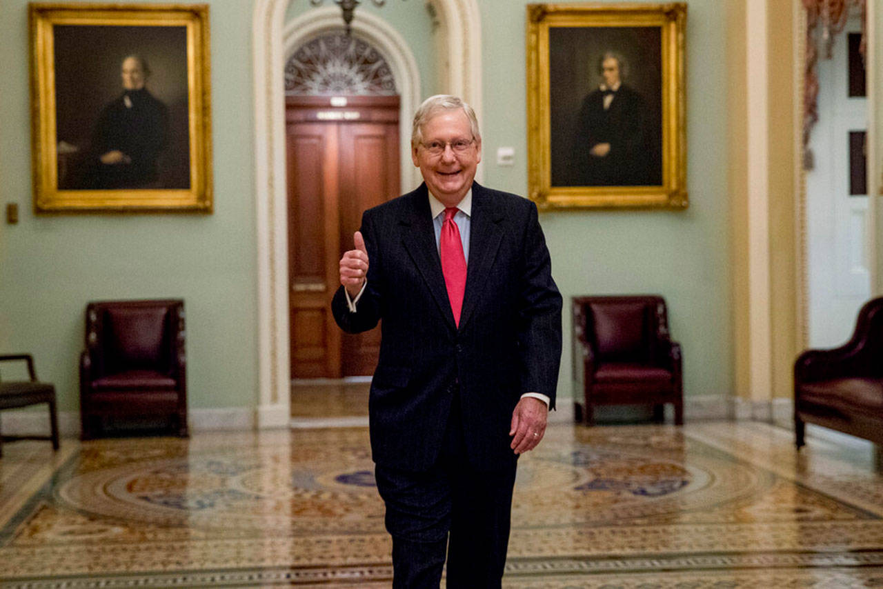 Senate Majority Leader Mitch McConnell of Kentucky gives a thumbs up as he arrives on Capitol Hill on Wednesday, March 25, 2020, in Washington. (Andrew Harnik/The Associated Press)