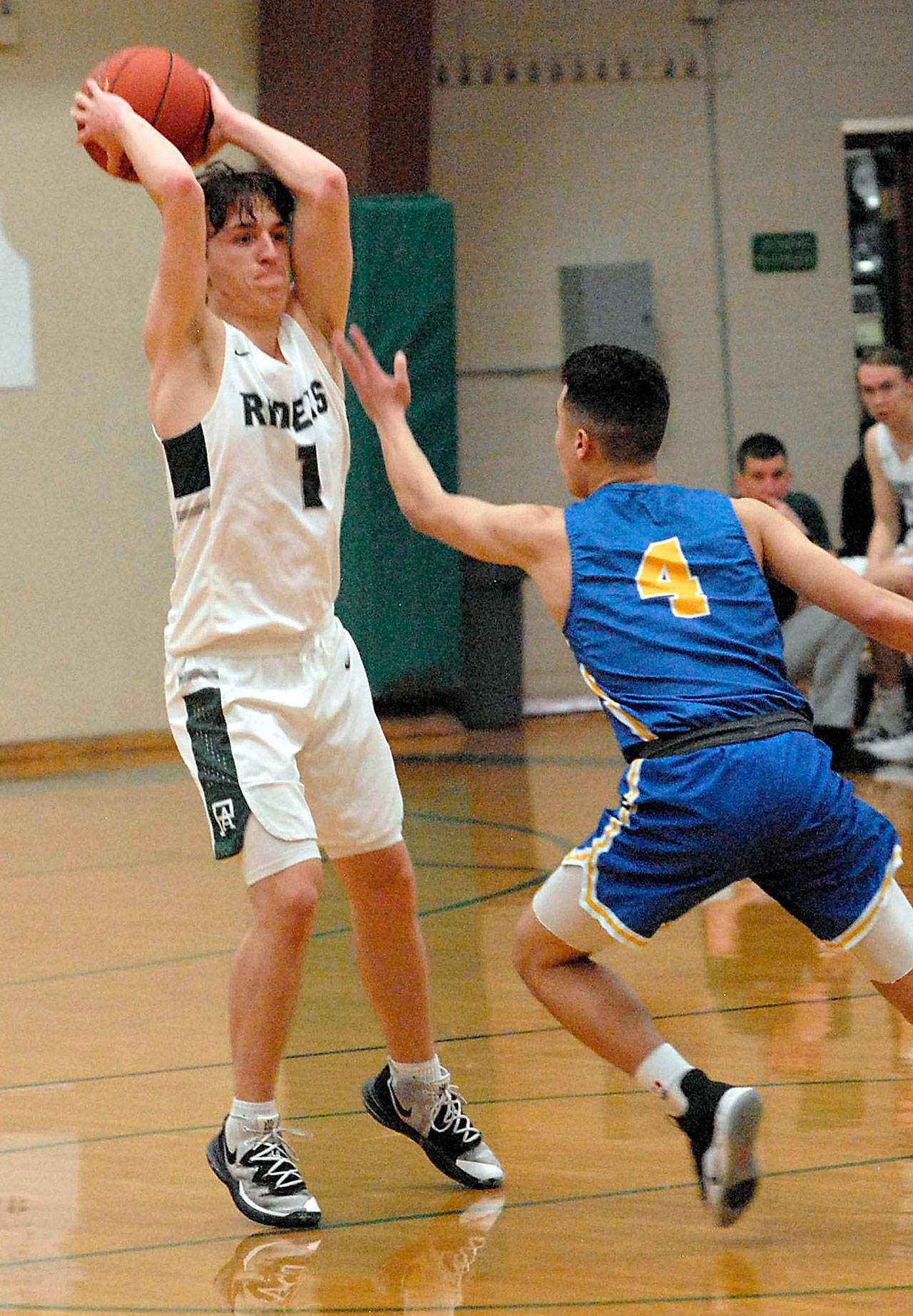 Port Angeles’ Gary Johnson, left, shown in a February game against Bremerton, is the All-Peninsula Boys Basketball MVP as selected by area coaches and the sports staff of the Peninsula Daily News. (Keith Thorpe/Peninsula Daily News)