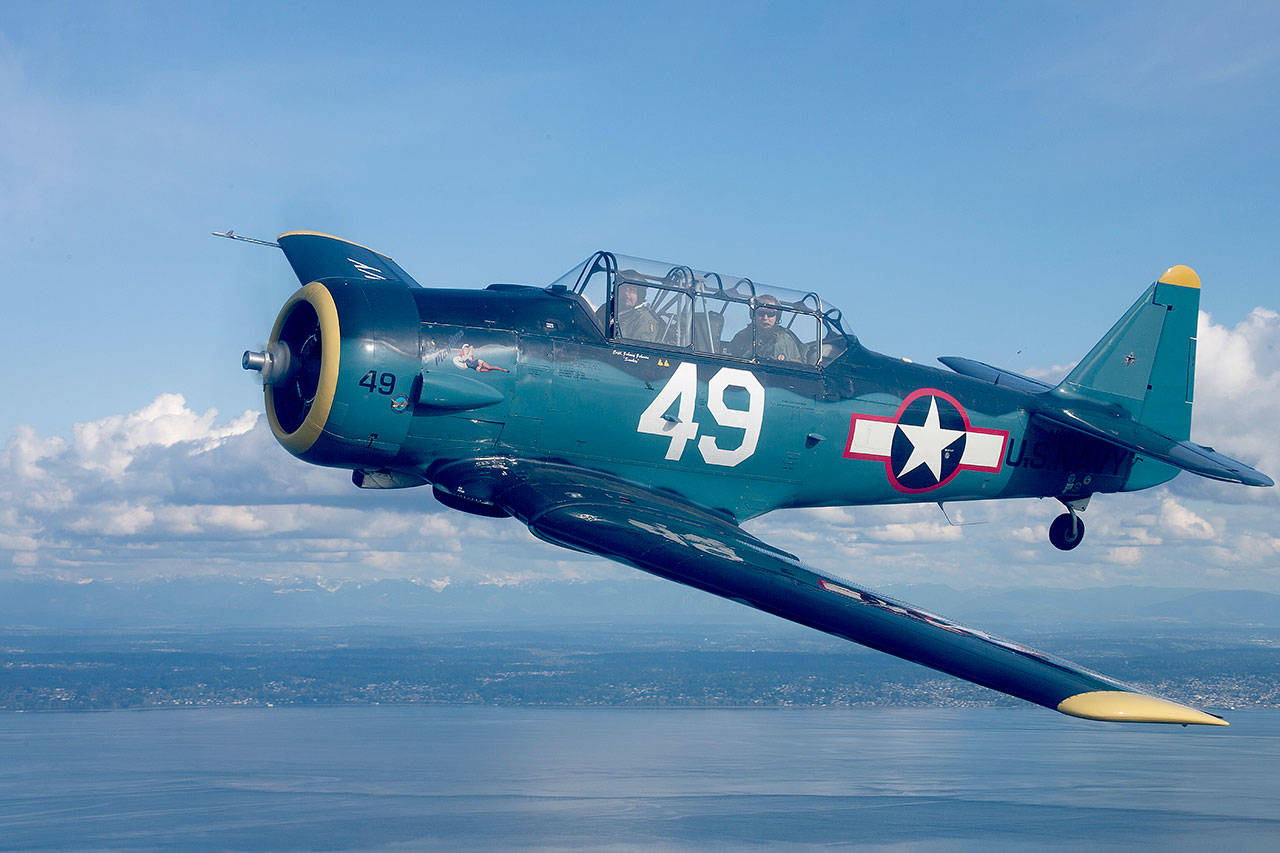 Pilot John “Smokey” Johnson and crew fly a World War II-era T-6 fighter jet from the Cascade Warbirds nonprofit educational organization. (John Clark)