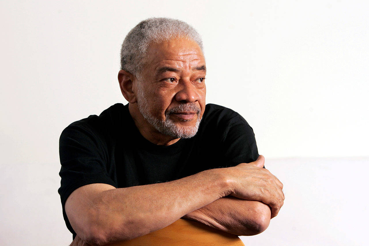 In this June 21, 2006, file photo, singer-songwriter Bill Withers poses in his office in Beverly Hills, Calif. Withers, who wrote and sang a string of soulful songs in the 1970s that have stood the test of time, including “Lean On Me,” “Lovely Day” and “Ain’t No Sunshine,” died in Los Angeles from heart complications Monday, March 30, 2020. He was 81. (Reed Saxon/Associated Press file)