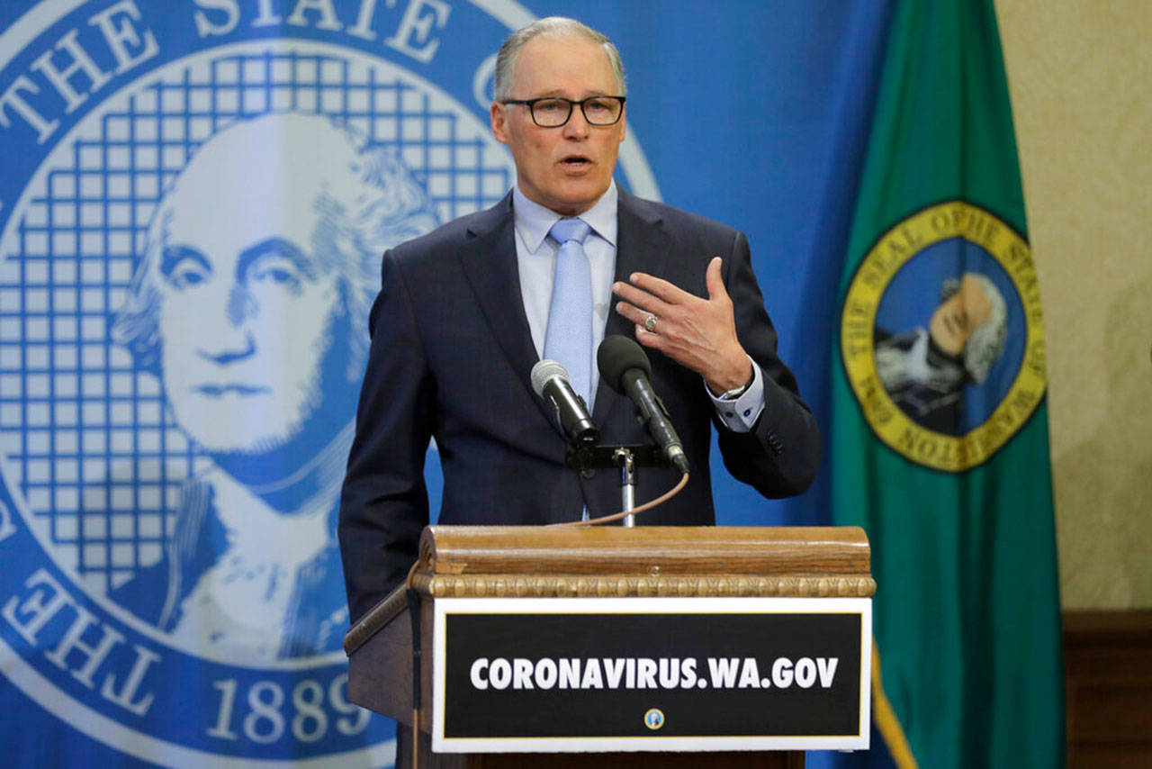 Washington Gov. Jay Inslee speaks at a news conference Monday, April 6, 2020, at the Capitol in Olympia. Inslee announced Monday that schools will remain physically closed for the remainder of the school year due to the coronavirus outbreak, and that public and private school students will continue distance learning through June. (Ted S. Warren/The Associated Press)