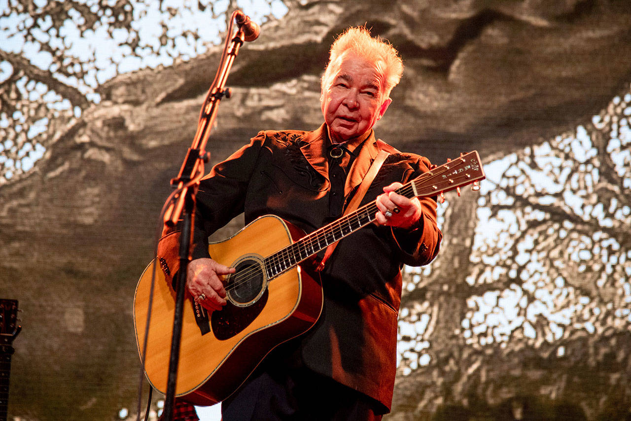This June 15, 2019, file photo shows John Prine performing at the Bonnaroo Music and Arts Festival in Manchester, Tenn. The family of John Prine says the singer-songwriter is critically ill and has been placed on a ventilator while being treated for COVID-19-type symptoms. A message posted on Prine’s Twitter page Sunday, March 29, 2020, said the “Angel from Montgomery” singer has been hospitalized since Thursday and his condition worsened Saturday. (Photo by Amy Harris/Invision/AP, file)