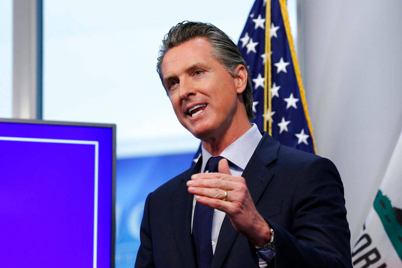 In this file photo taken Tuesday, April 14, 2020, California Gov. Gavin Newsom discusses an outline for what it will take to lift coronavirus restrictions during a news conference at the Governor’s Office of Emergency Services in Rancho Cordova, Calif. President Donald Trump declared that states could “call your own shots” in determining how and when to loosen restrictions on businesses and social gatherings. Clusters of states representing the vast majority of Americans have decided cooperation in dealing with the coronavirus is the better option. (Rich Pedroncelli/The Associated Press file)