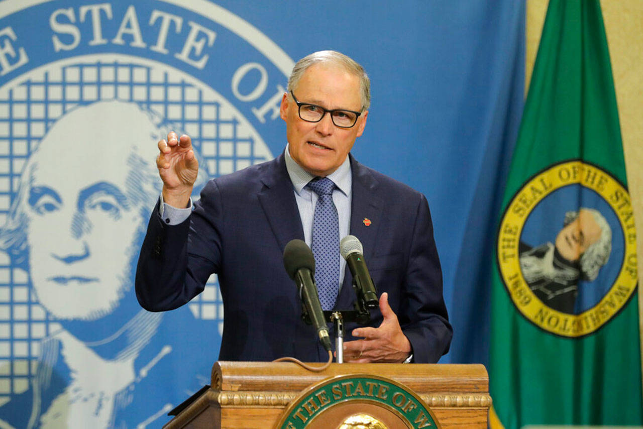Washington Gov. Jay Inslee speaks during a news conference Monday, April 13, 2020, at the Capitol in Olympia. Inslee, along with California Gov. Gavin Newsom and Oregon Gov. Kate Brown, announced Monday that they will work together to re-open their economies while continuing to control the spread of COVID-19. (Ted S. Warren/Associated Press)