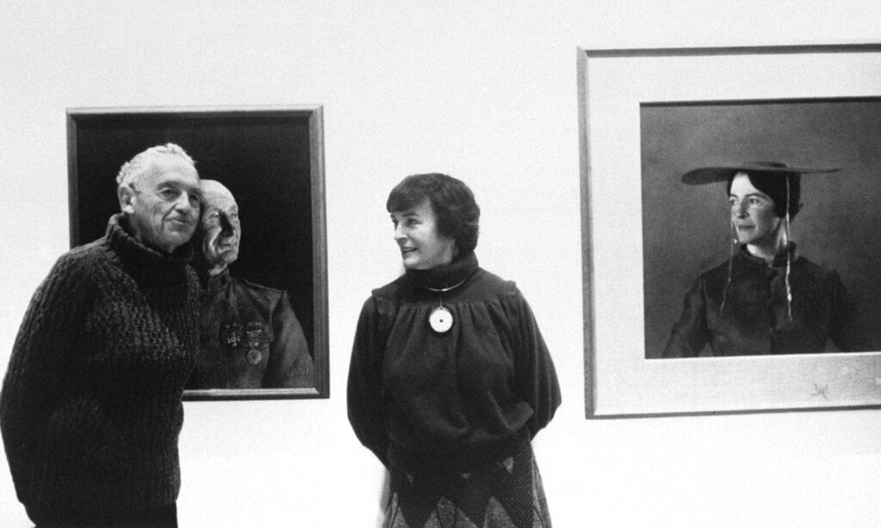 In this May 1985 file photo, American artist Andrew Wyeth poses with his wife Betsy at an unknown location in front of his paintings “The Patriot,” left, and “Maga’s Daughter” for which Betsy was the model. Betsy James Wyeth, the widow, business manager and muse of painter Andrew Wyeth, died Tuesday, April 21, 2020, at age 98, according to the Brandywine River Museum of Art in Chadds Ford, Pa., which she helped found. (Associated Press file)