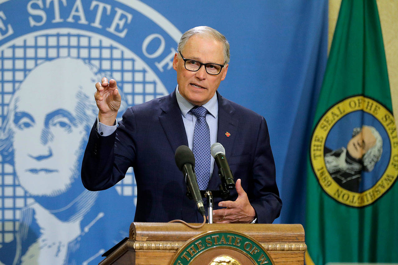 In this Monday, April 13, 2020, file photo, Gov. Jay Inslee speaks during a news conference at the Capitol in Olympia. Inslee has repeatedly said he will rely on scientific models and input from state health officials to determine when stay-at-home orders can be relaxed, despite growing calls for them to be ended, including a protest that drew about 2,500 to the state Capitol. (Ted S. Warren/Associated Press file)